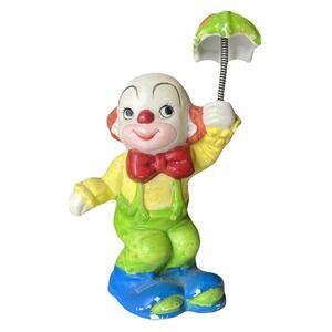 Vintage UCCG porcelain circus clown figurine holding an umbrella